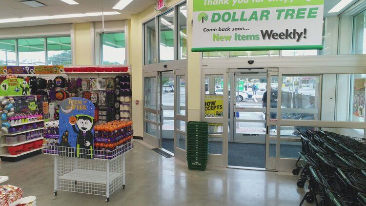 The inside of a dollar tree store with a sign that says dollar tree new items weekly.