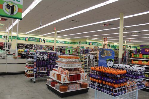 The inside of a dollar tree store filled with lots of halloween decorations.
