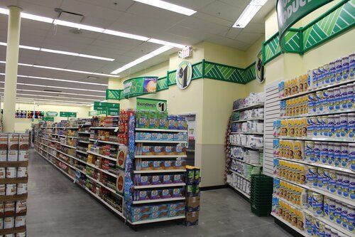 A grocery store aisle filled with lots of products