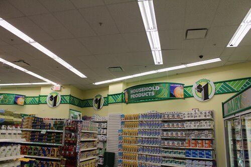 The inside of a store with a sign that says household products