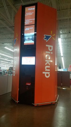 A large orange pickup machine in a store