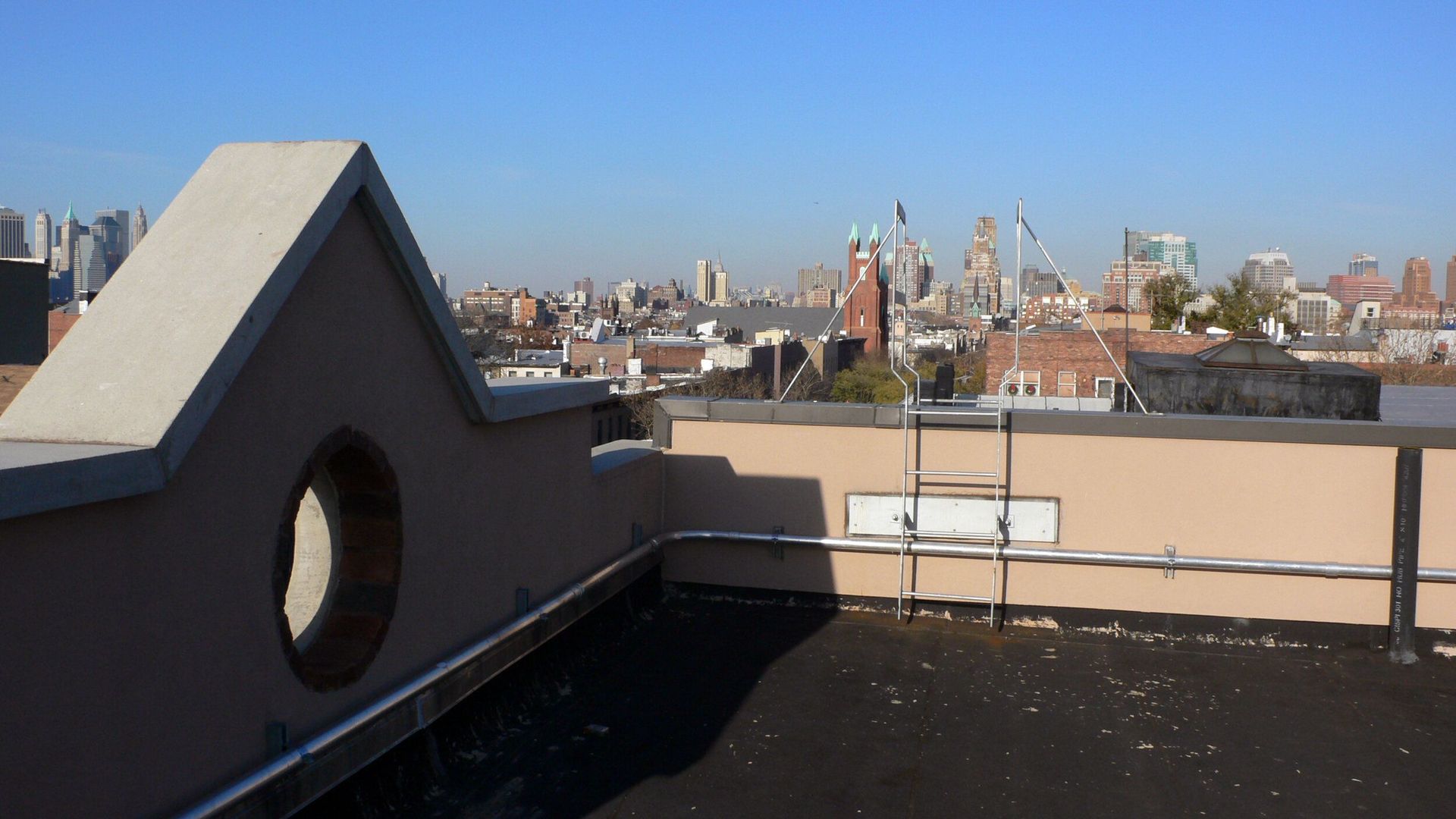 A view of a city from the roof of a building