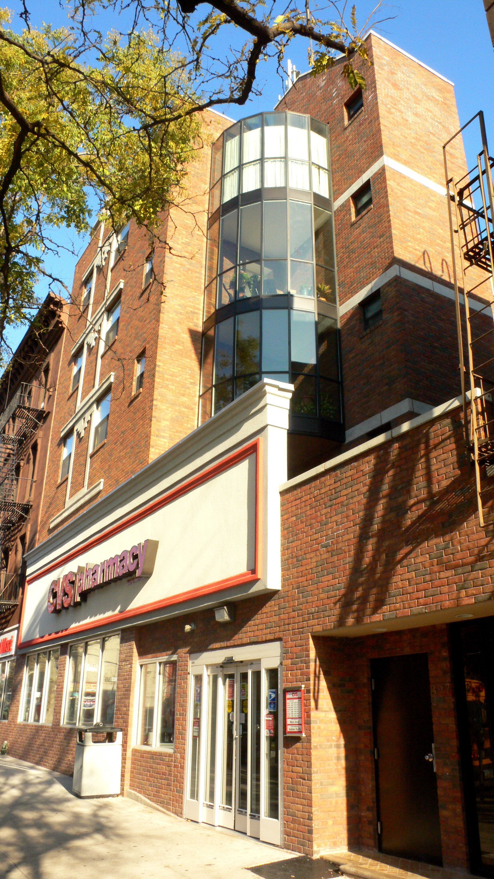 A large brick building with a restaurant on the side of it