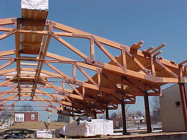 A large wooden structure with a blue sky in the background