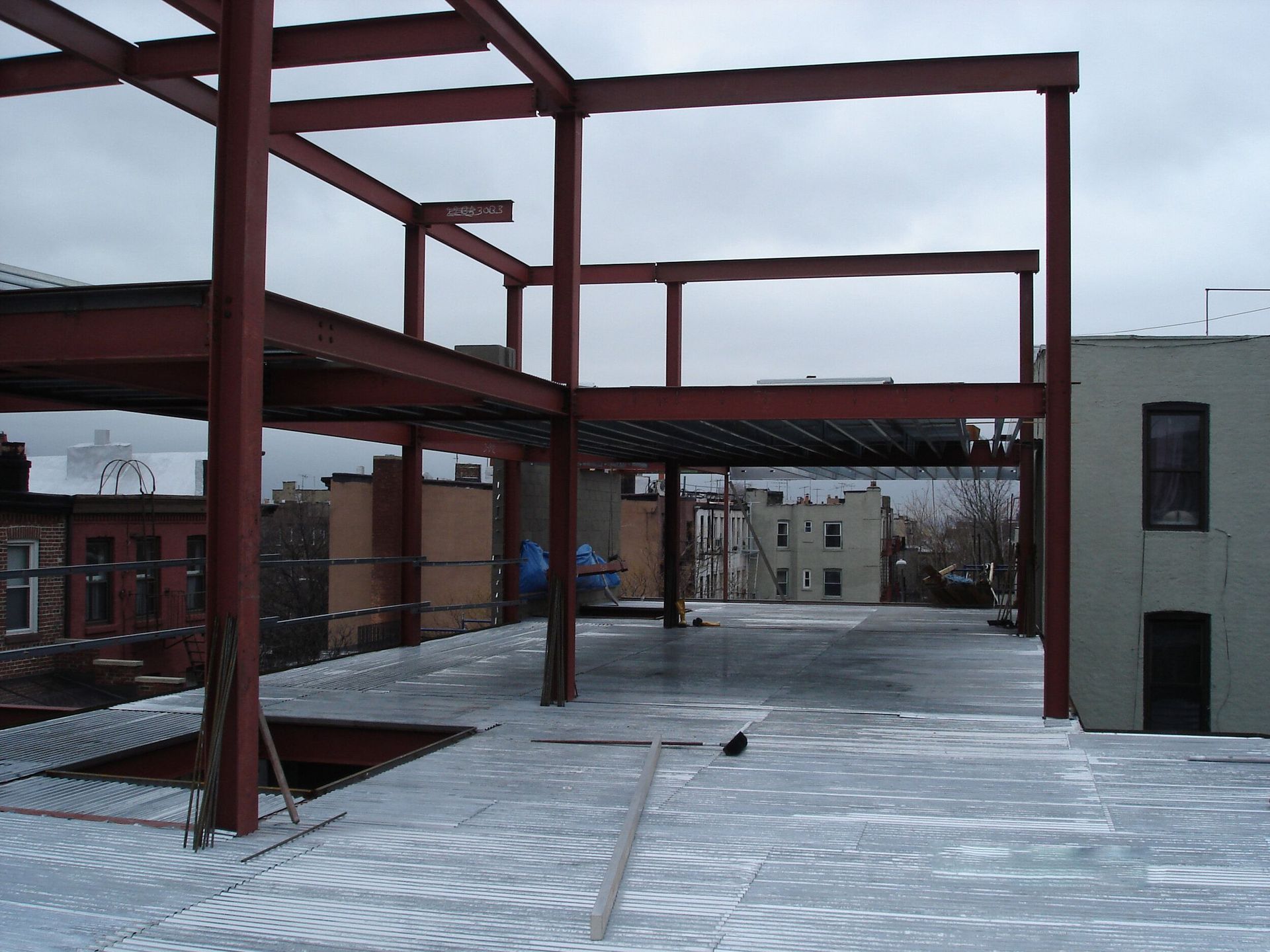 A building under construction with snow on the ground