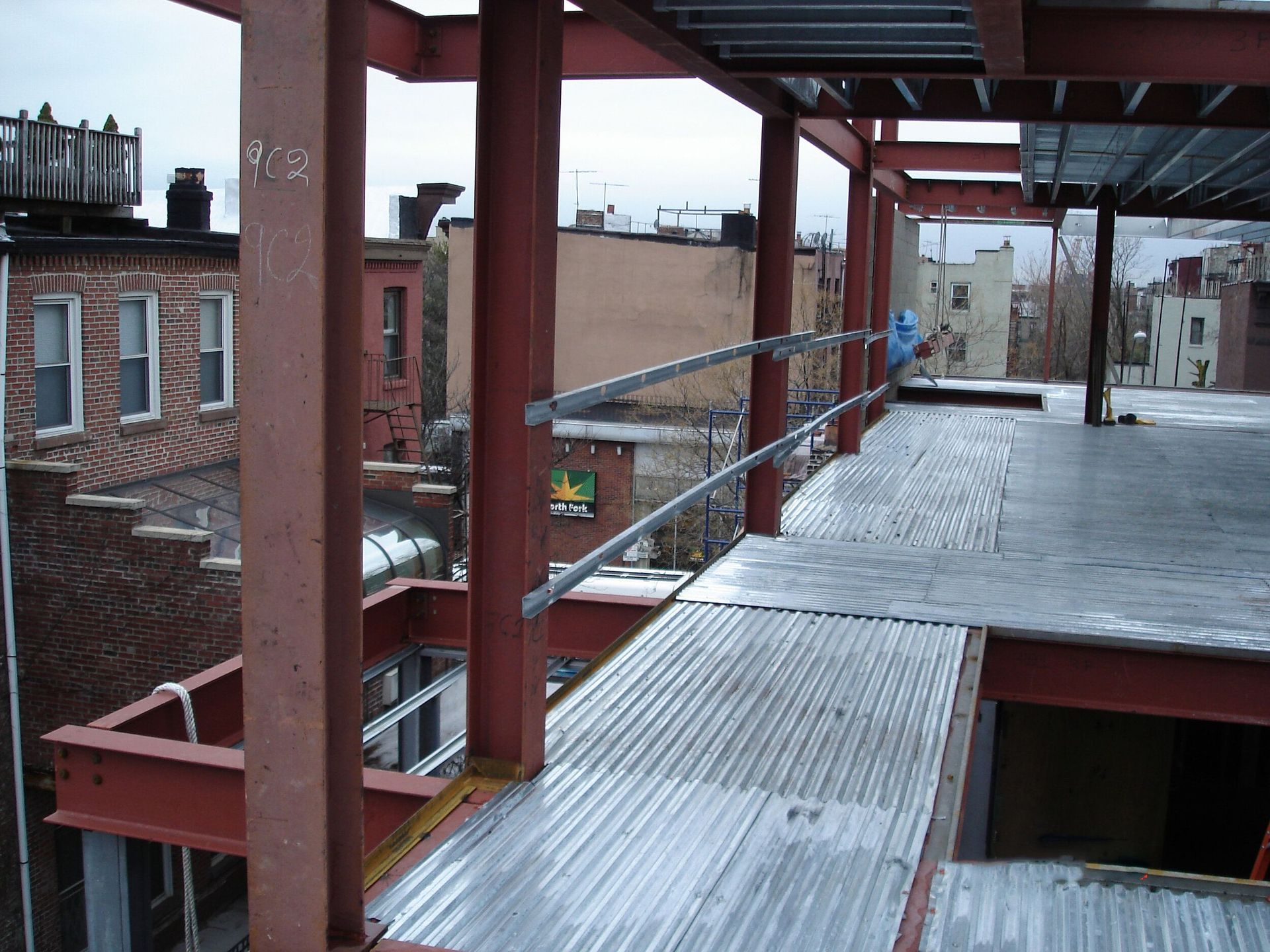 A view of a city from the top of a building under construction