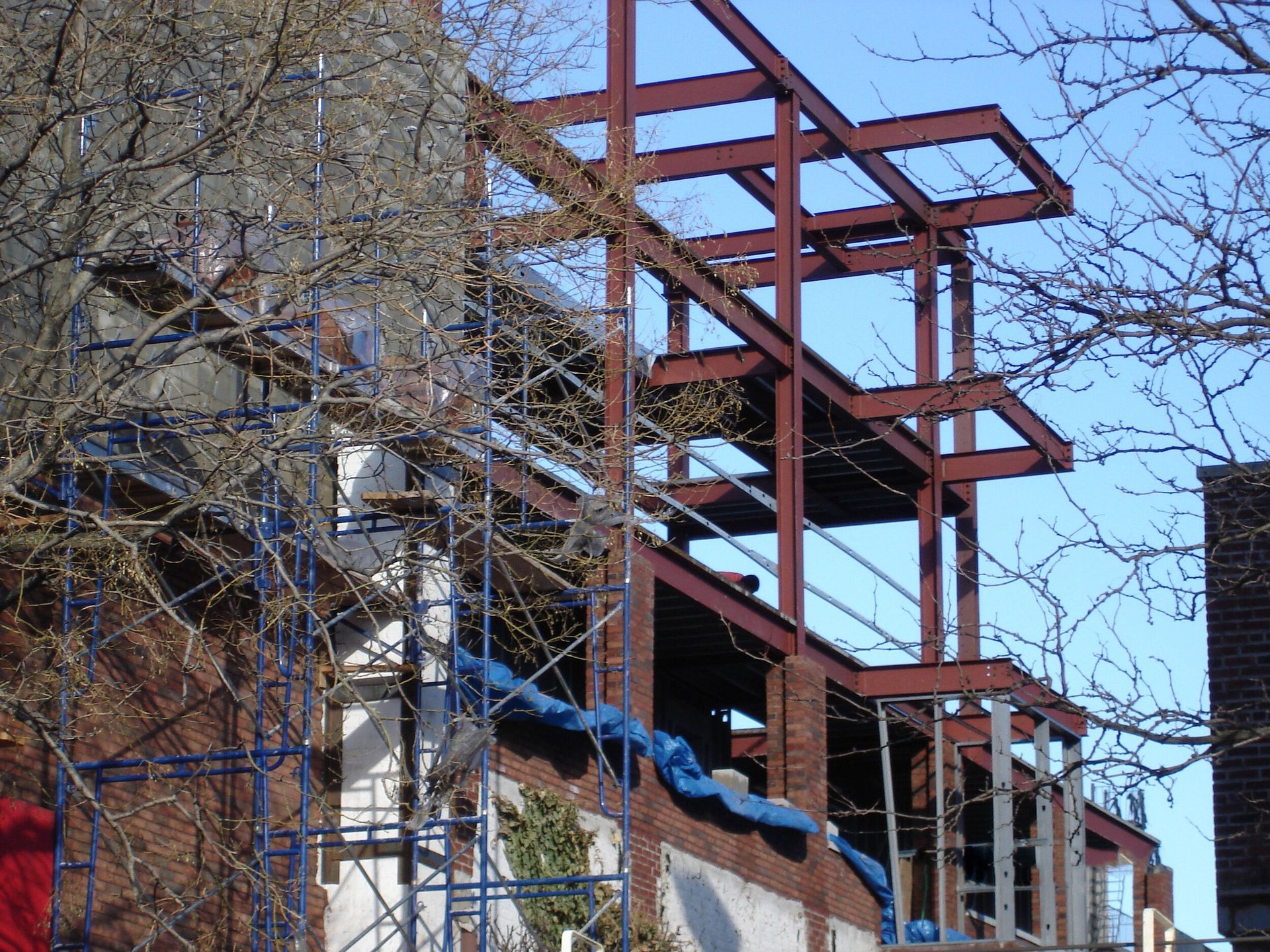 A building under construction with scaffolding around it