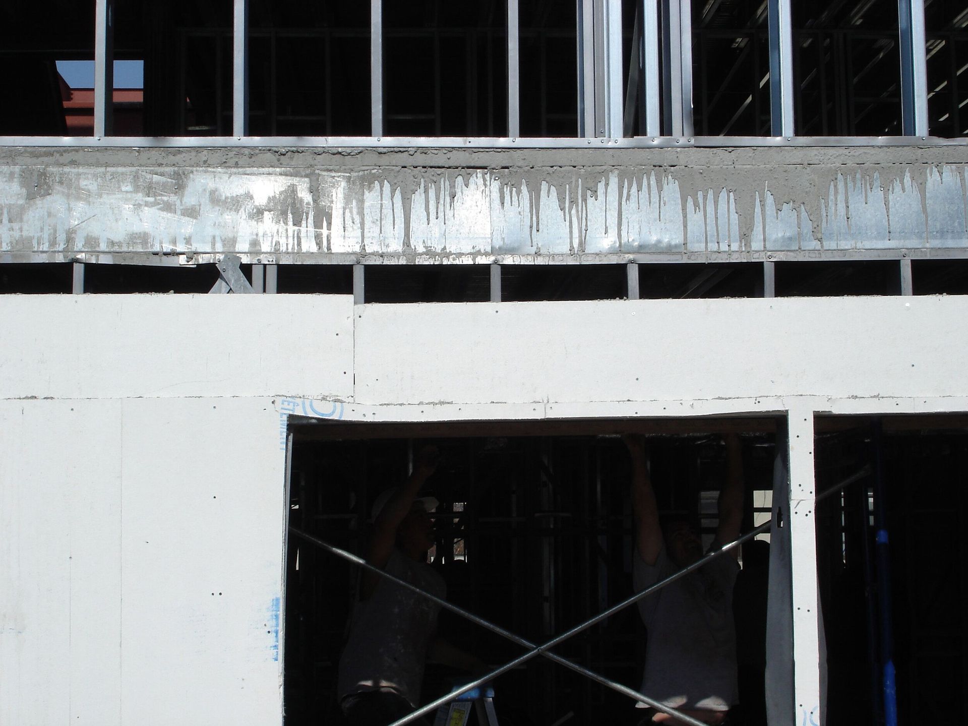 A building that is being built with a lot of windows