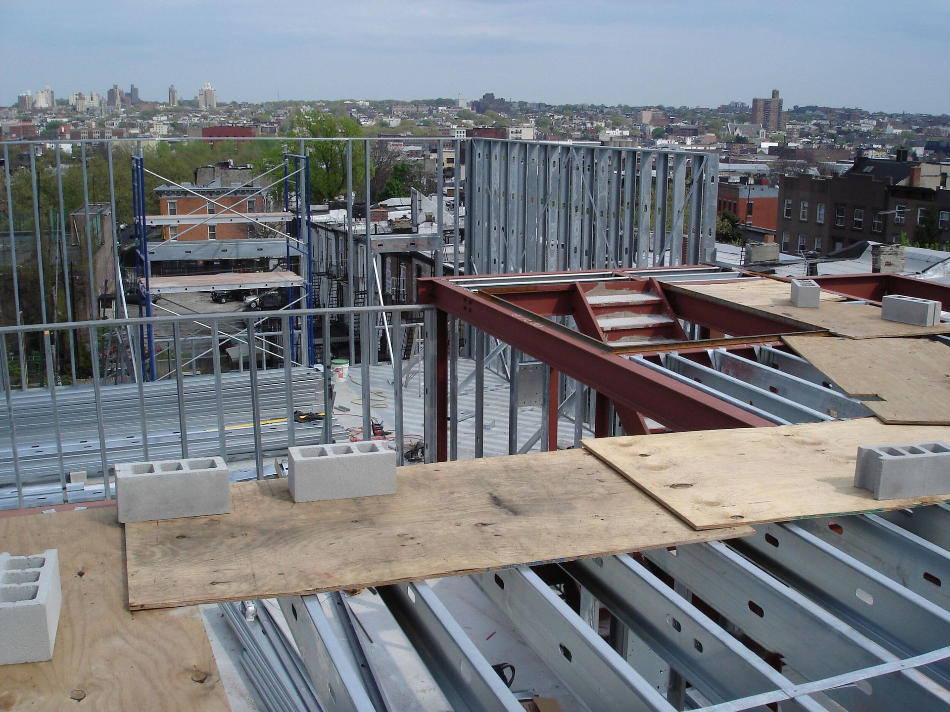 A view of a city from the top of a building under construction
