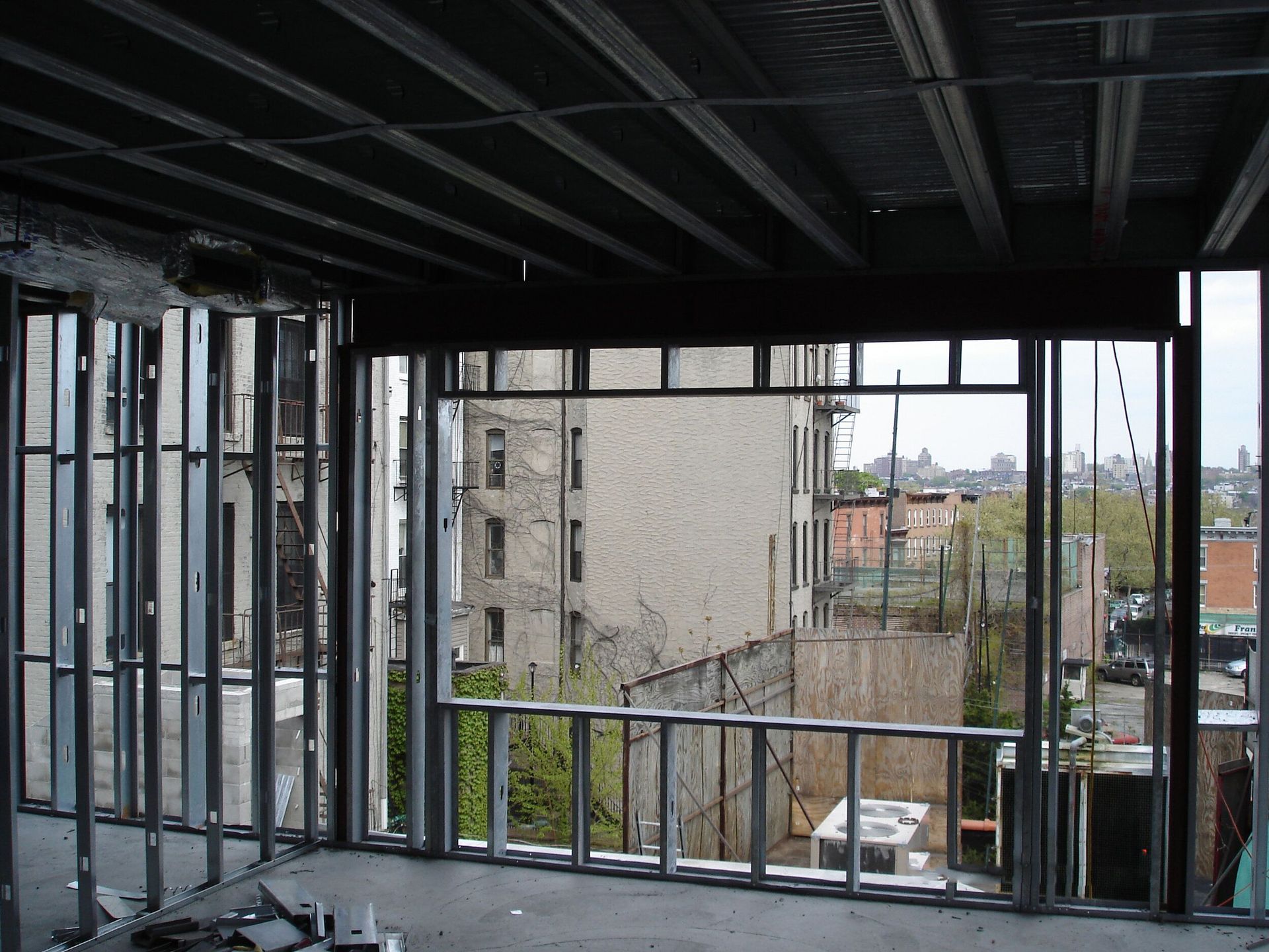 A building under construction with a view of a city