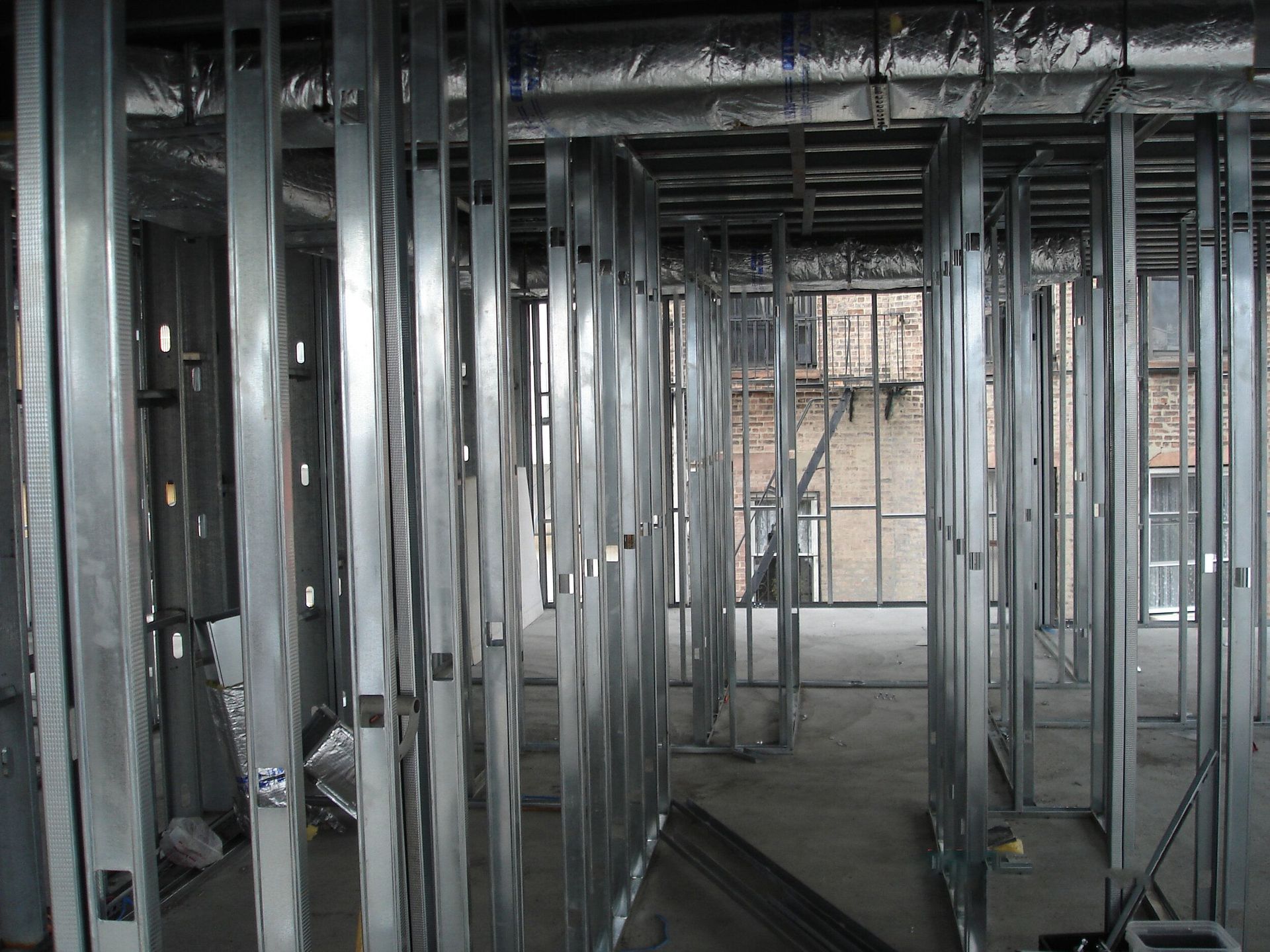 A building under construction with a lot of metal frames