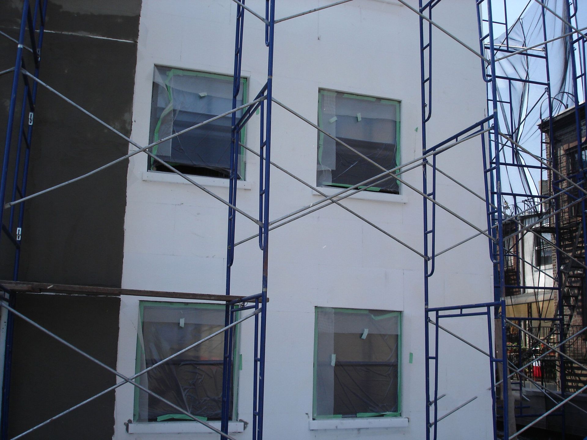 A building under construction with scaffolding around it