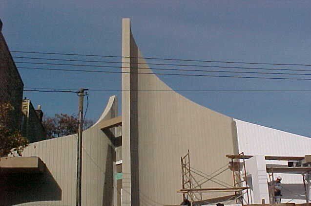 A large building with a scaffolding in front of it