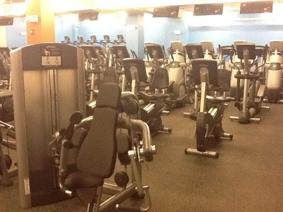 A gym filled with a lot of exercise equipment