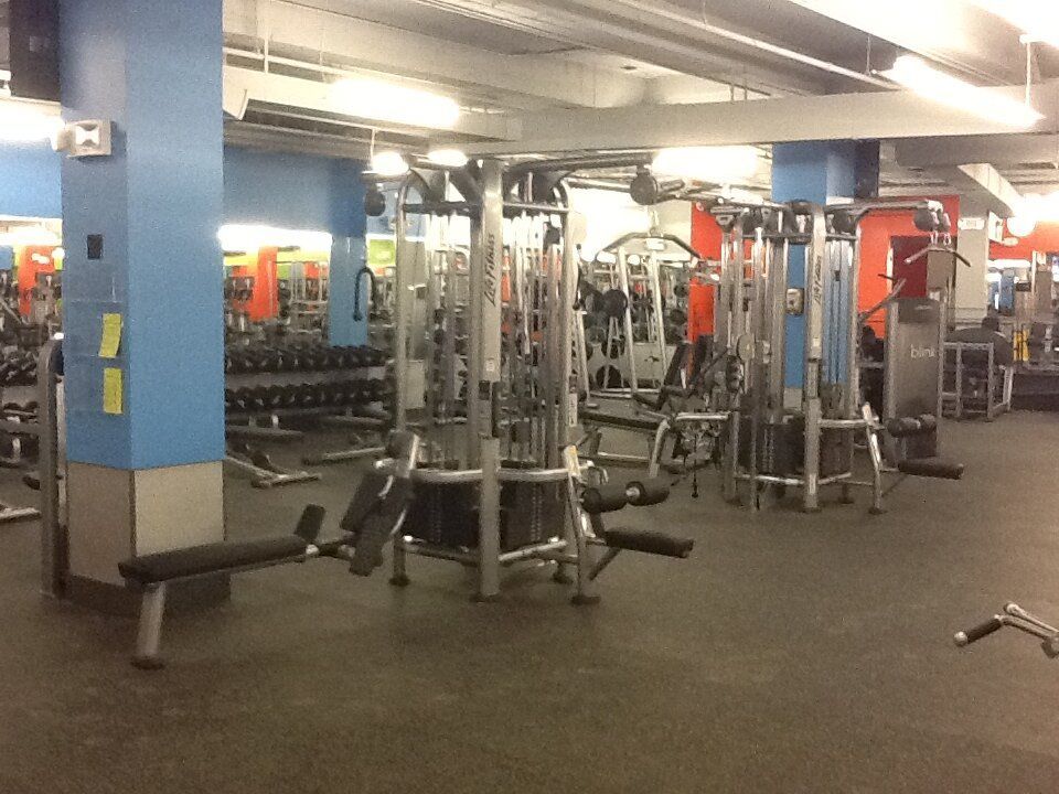 A gym with a lot of equipment and a sign that says h