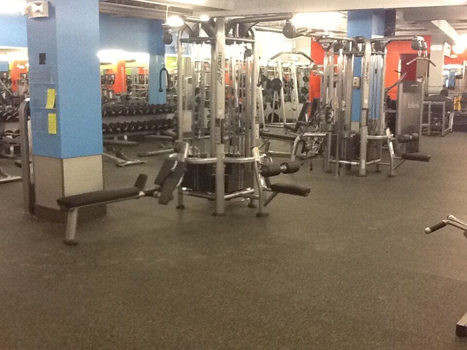 A gym filled with a lot of exercise equipment