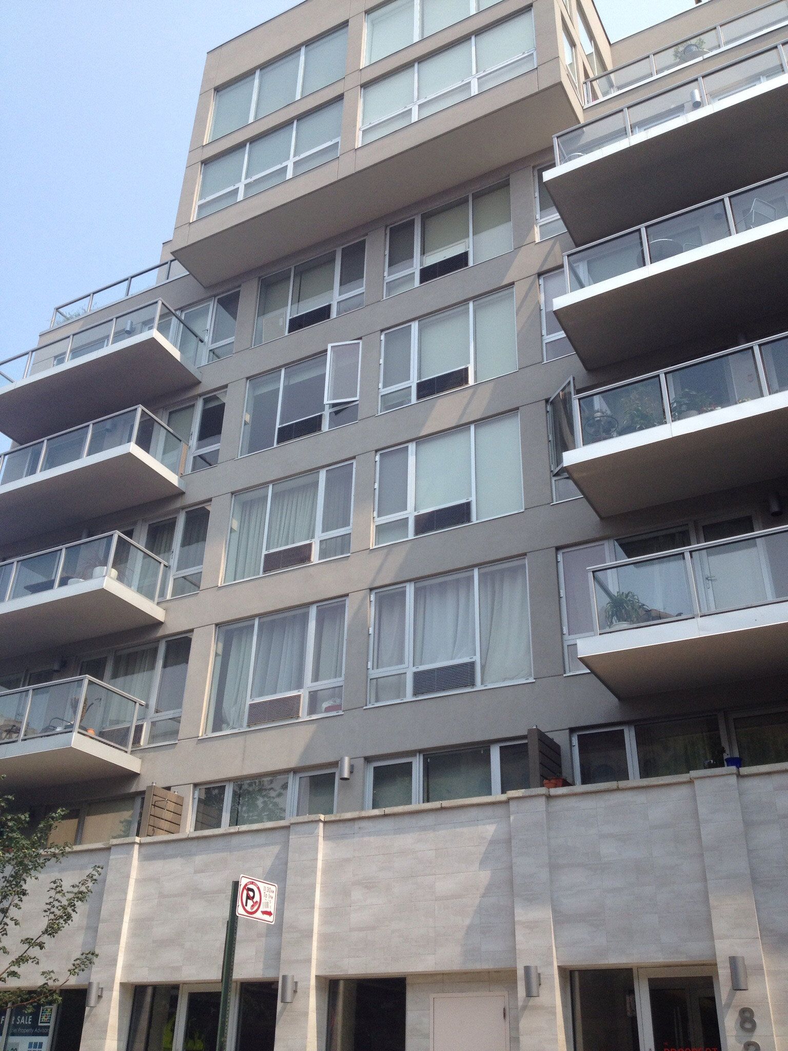 A large apartment building with lots of windows and balconies