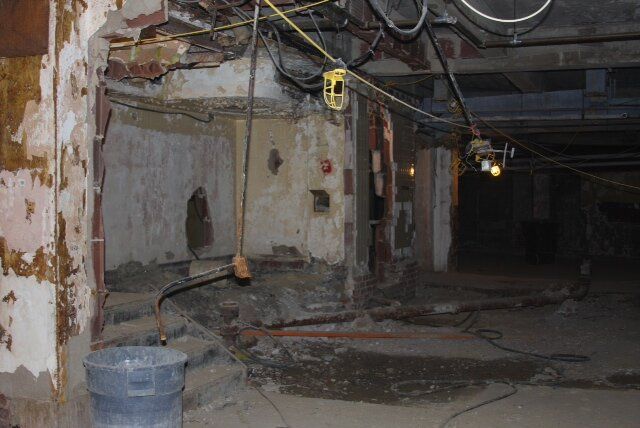 There is a bucket in the corner of the room.