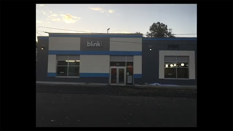 A blue and white building with the word bleki on it