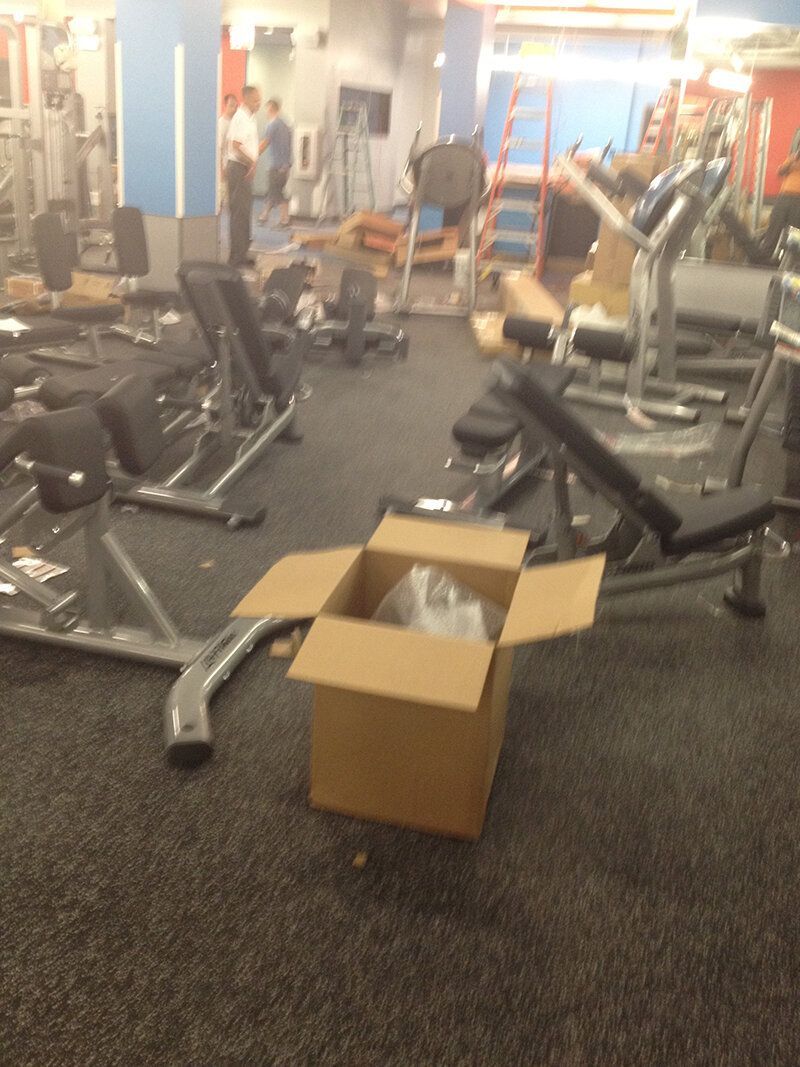 An empty gym with a cardboard box in the middle
