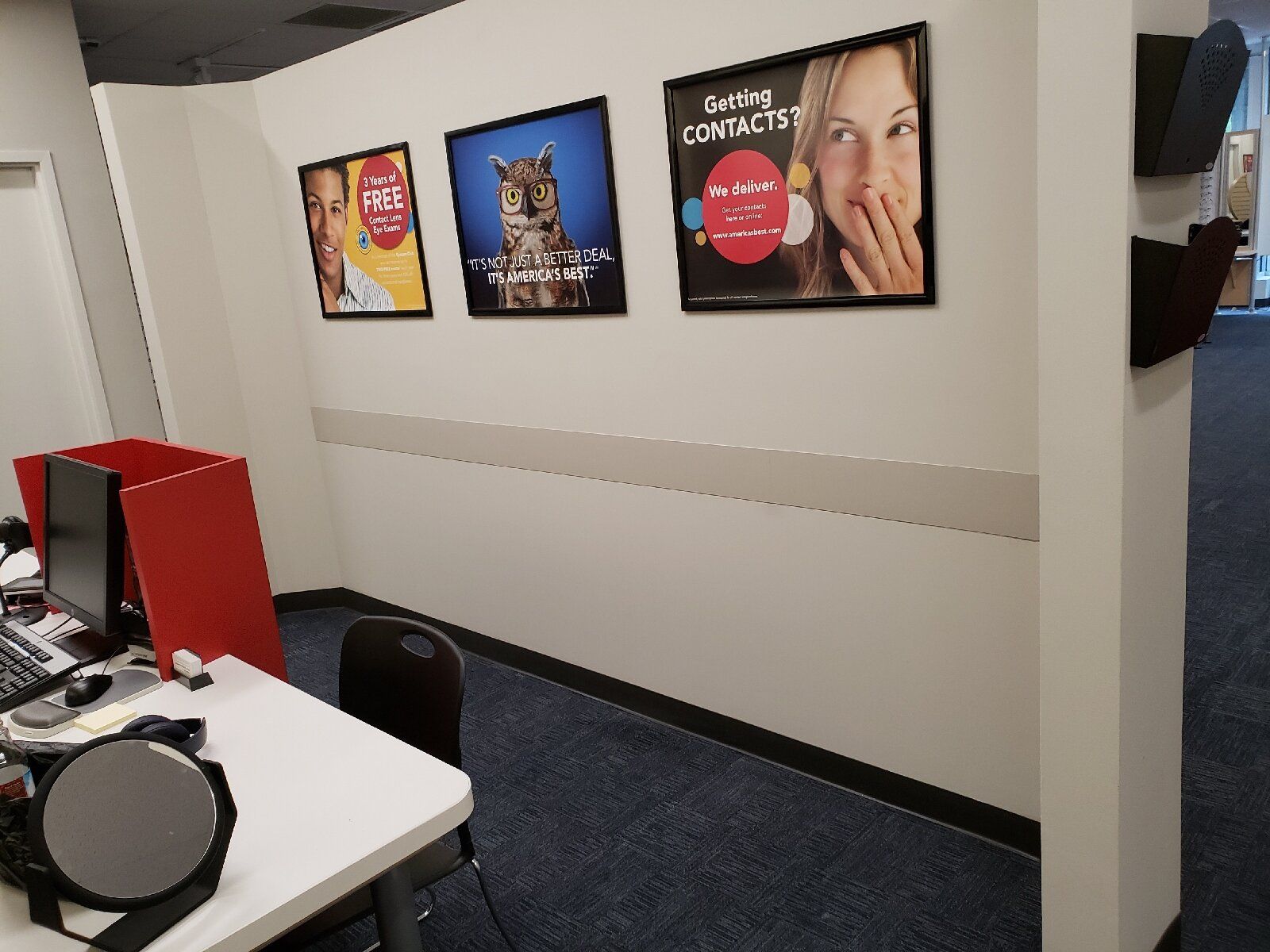 A room with pictures on the wall including one that says giving contacts