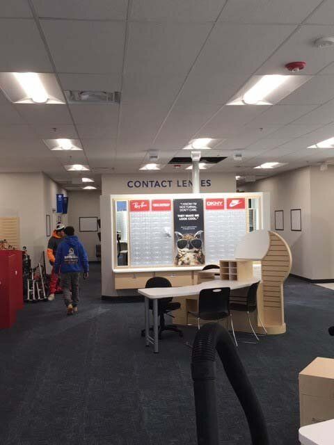 A store with a sign that says contact lenses