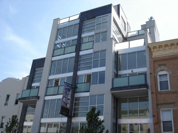 A large building with lots of windows and balconies