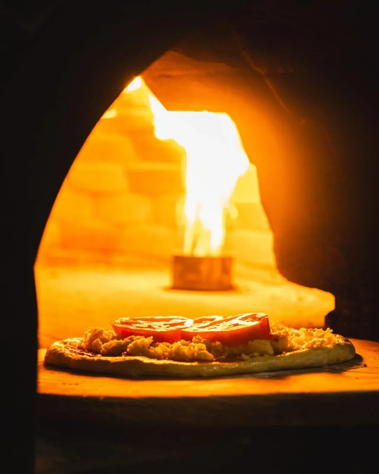 Logotipo do Bellini Ristorante em letra cursiva preta sobre fundo branco. 