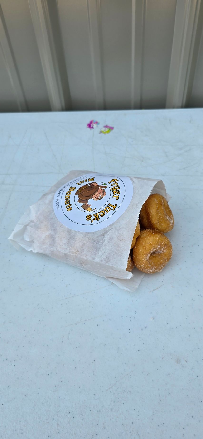 People toasting with cocktails at a bar.