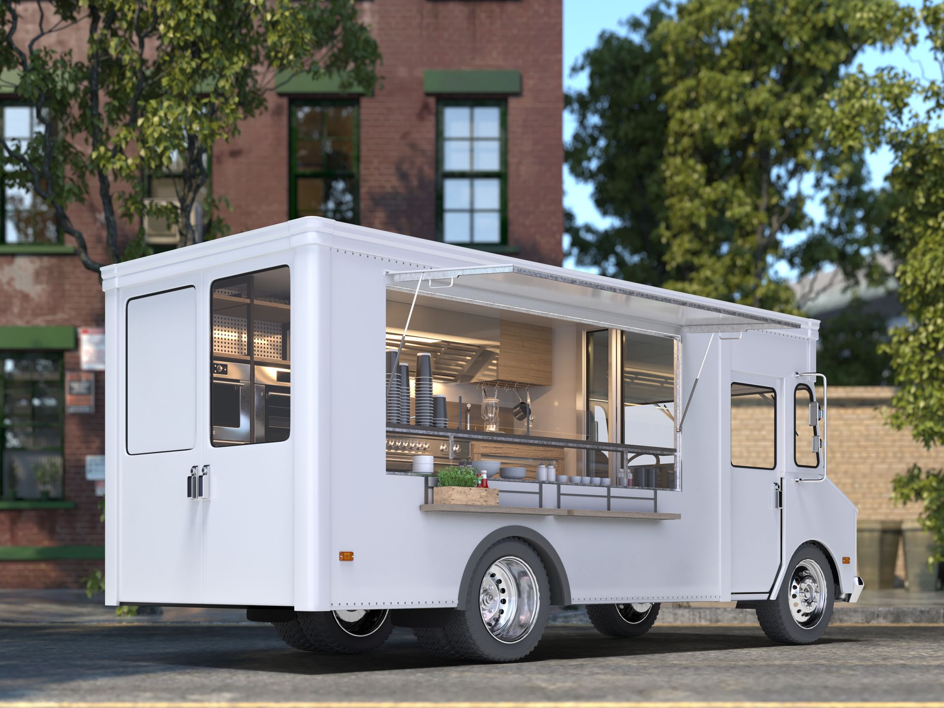 White food truck parked on street with open service window. Building in background.