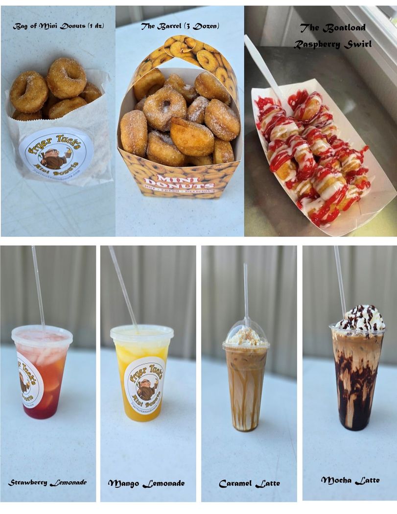 Assortment of donuts on a wooden surface: frosted with sprinkles, chocolate, and cinnamon sugar.