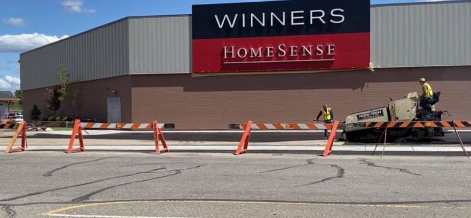 A construction site in front of a winners homesense store