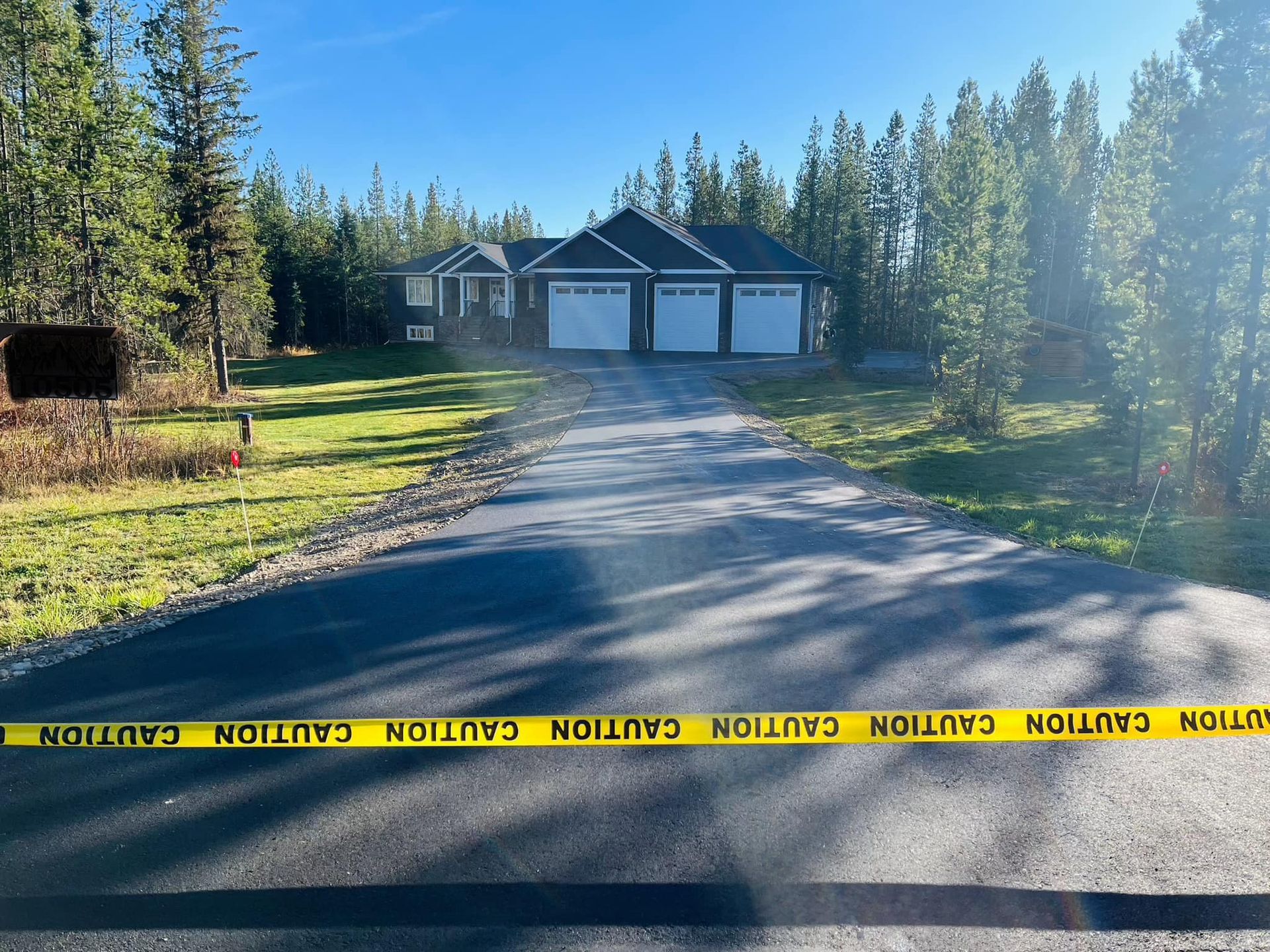 A road with a yellow caution tape on it