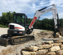 Backhoe — Foristell, MO — Wildschuetz Bros.  Trucking Inc
