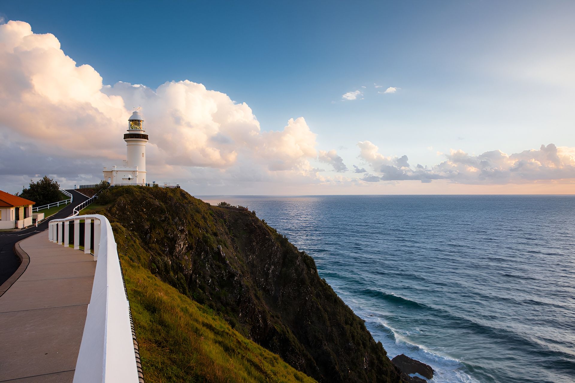 Coastal View of a Forested Hill With Houses and a Lighthouse — Dan's Removals In Byron Bay, NSW
