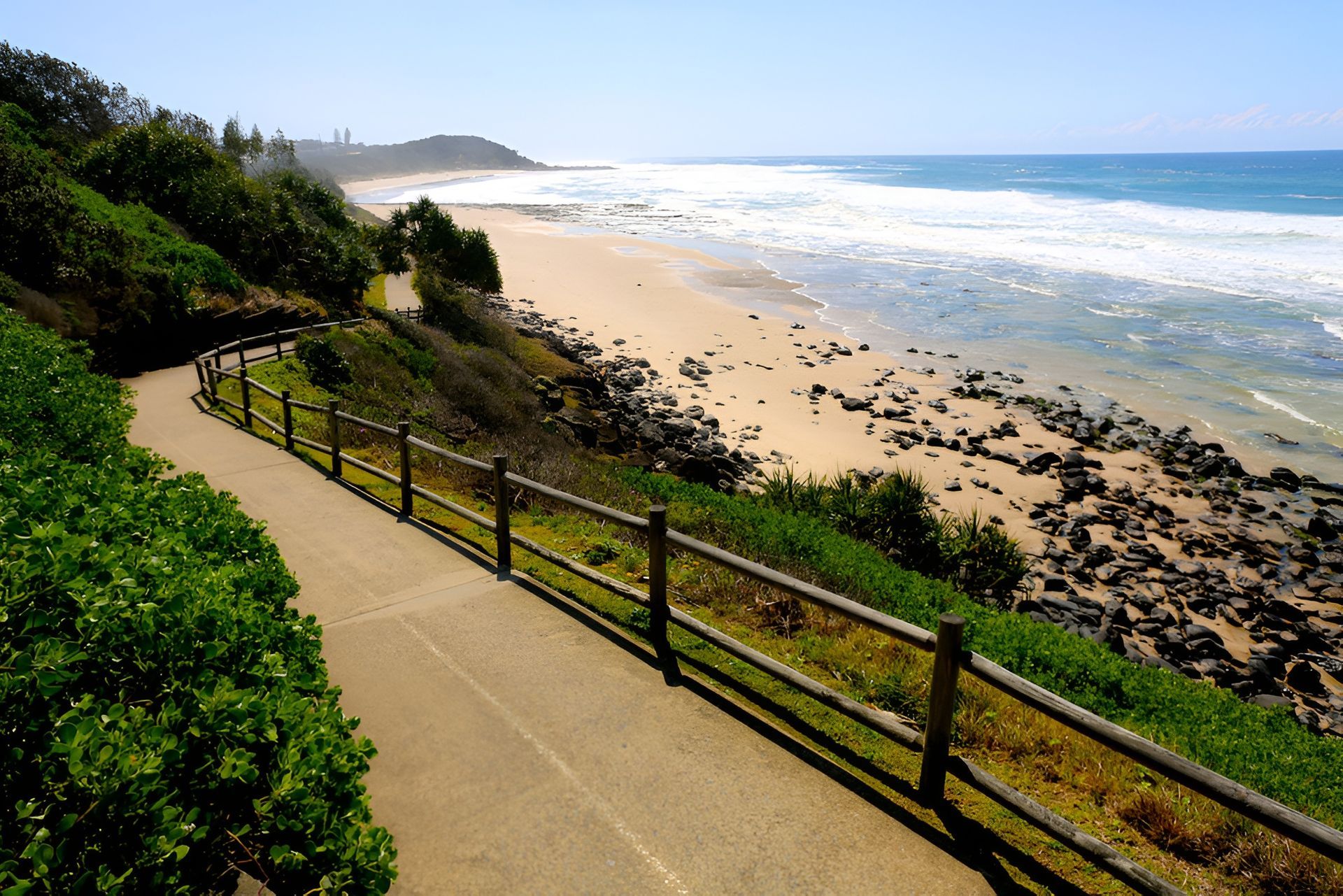 Coastal Path Winds Along a Sunny Beach with Ocean Waves — Dan's Removals In Ballina, NSW