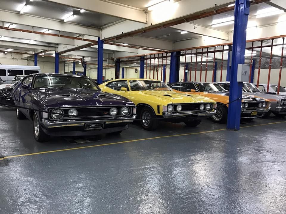 A Number of Automobiles Parked in a Garage — Restore Your Ford Falcon GT From Brisbane, NSW