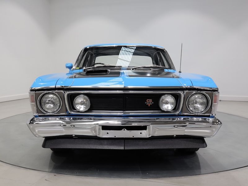 A Red Vehicle Parked on a Pattern-filled Floor — Honest & Reliable Falcon GT Evaluations in Sydney, NSW