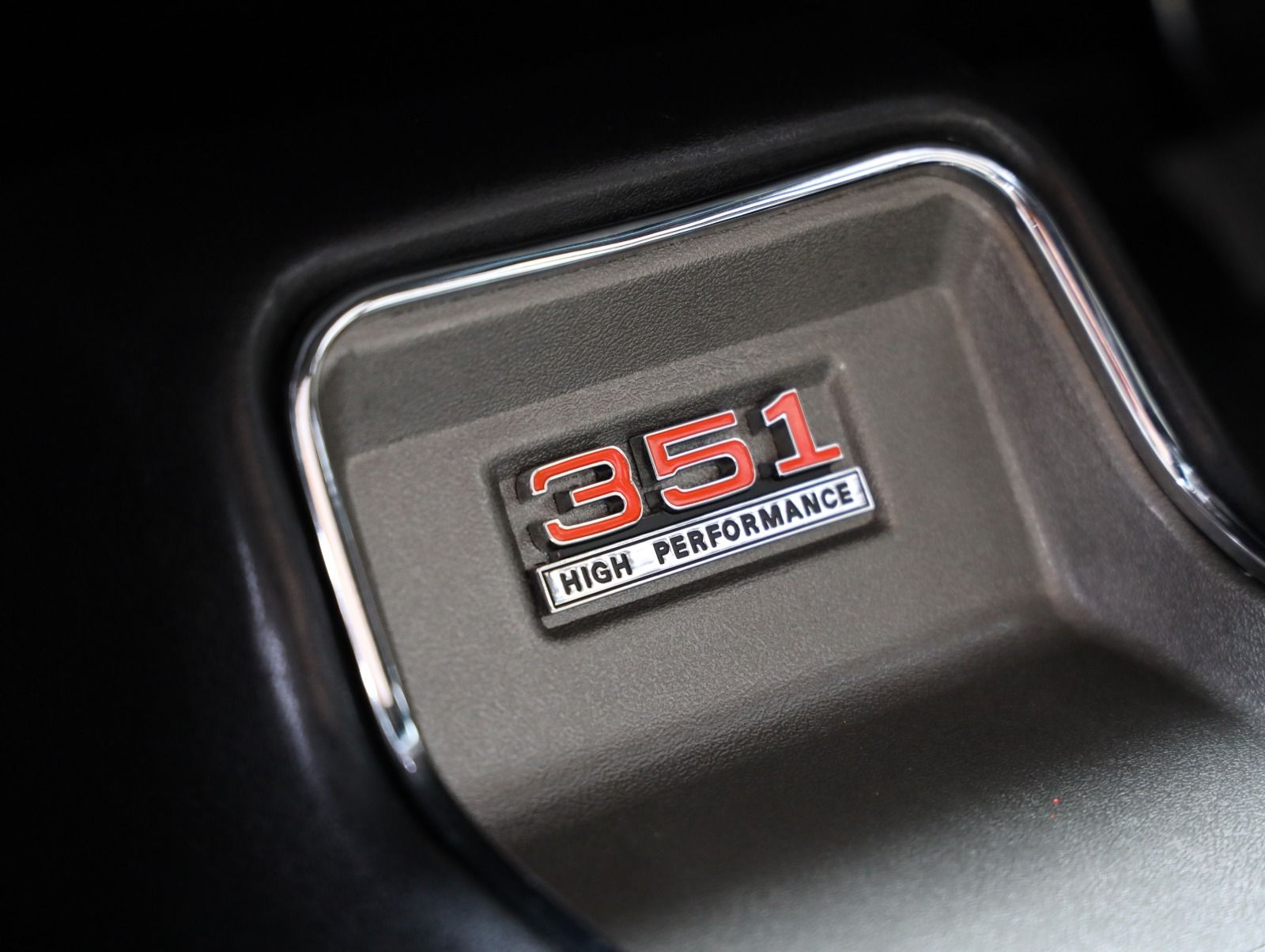 A close up of a car engine with the number 351 on it
