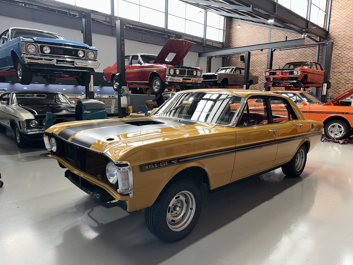 A Car on a Hoist in a Garage — Professional Falcon GT Restorations in Sydney, NSW
