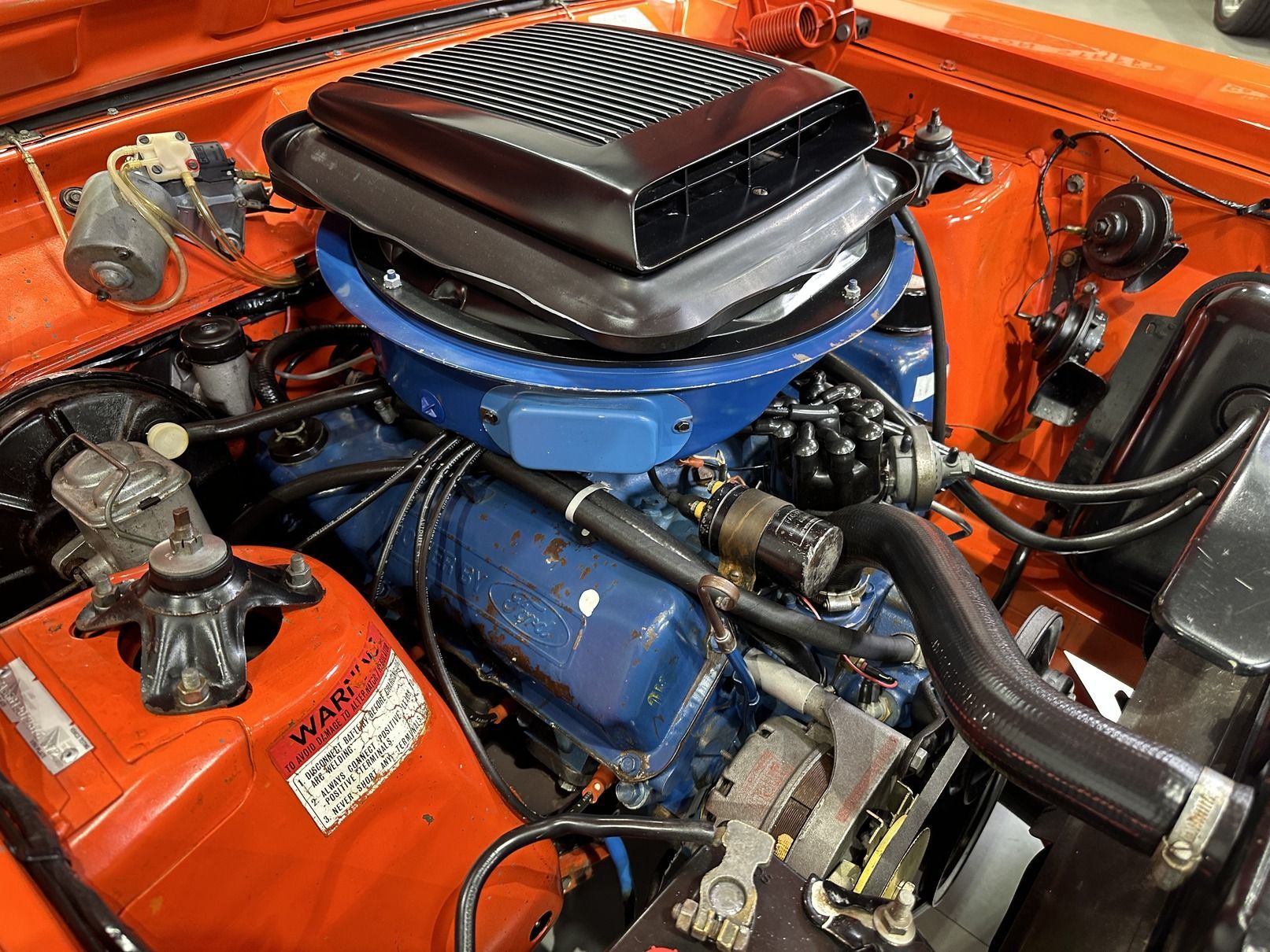 A Car With Its Hood Open and Installing Engine — Original Maintained Falcon GT Restorations in Sydney, NSW