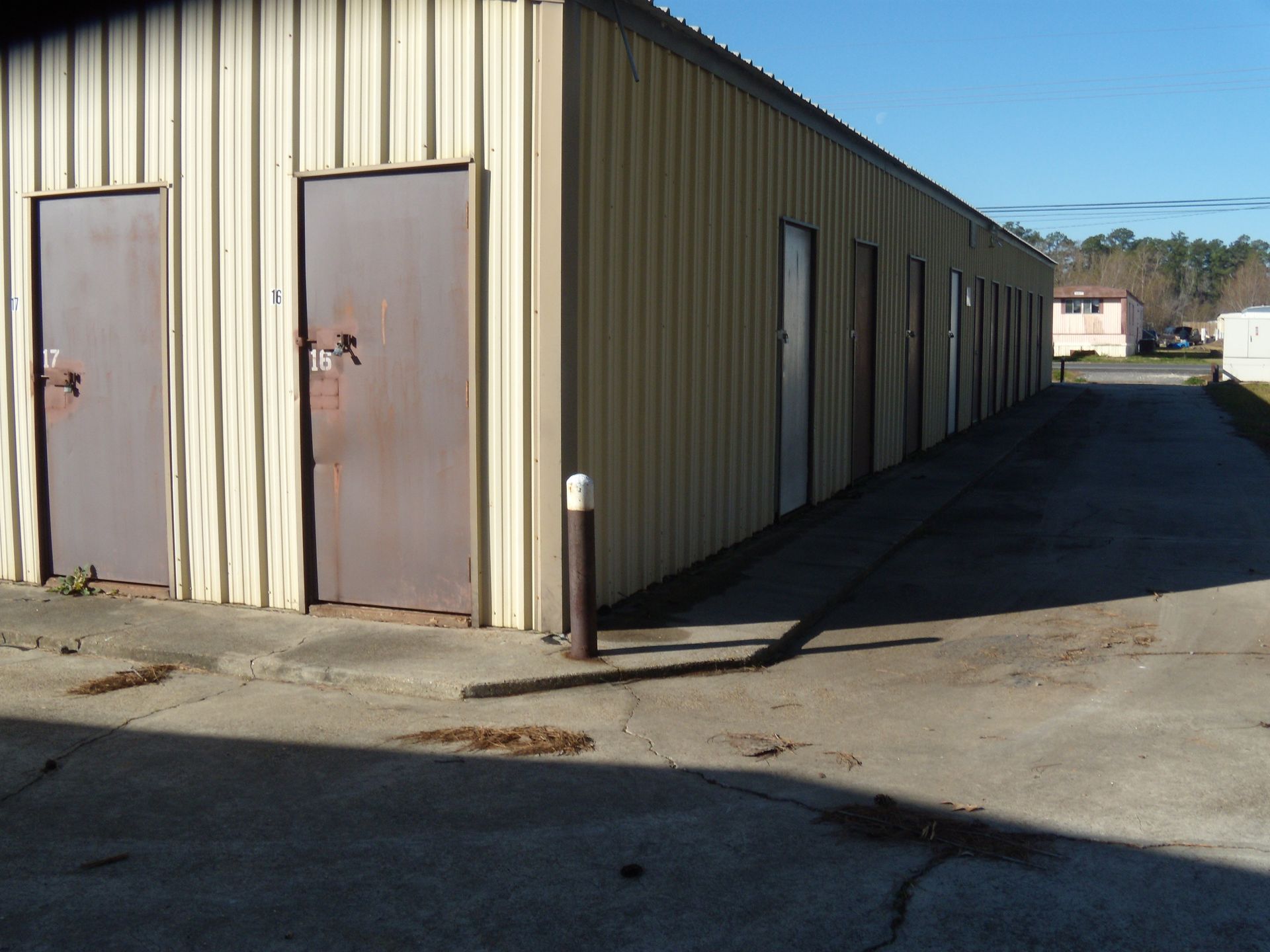 A long hallway filled with rows of empty storage units