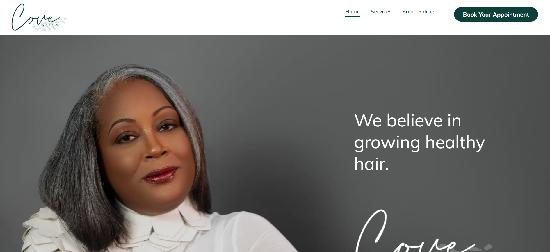 Website promoting hair health. Woman with gray hair smiles; text reads