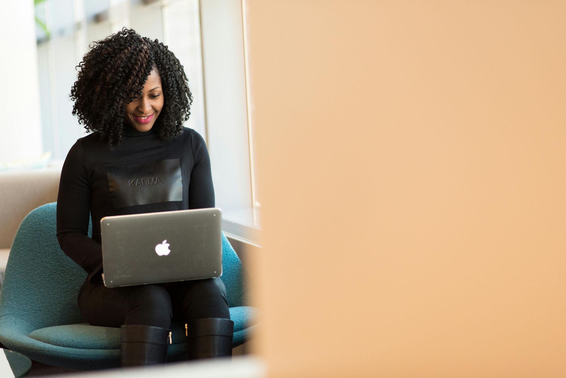Woman typing on a computer.