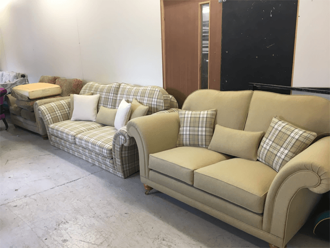 two cream and patterned sofas