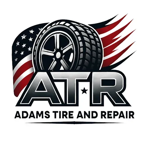 Logo for Adams Tire and Repair: Tire with American flag background, "ATR" in bold letters, business name below.