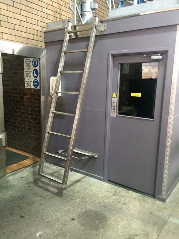 A ladder is attached to the side of a building