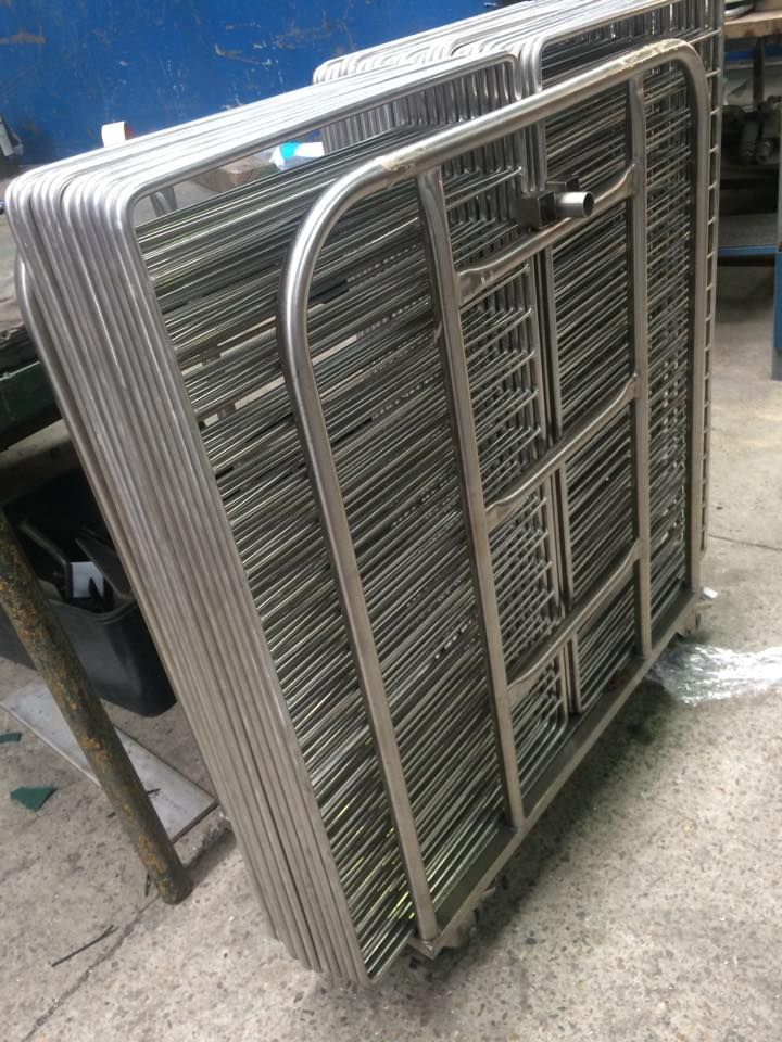 A stack of metal pipes sitting on top of each other on a table.