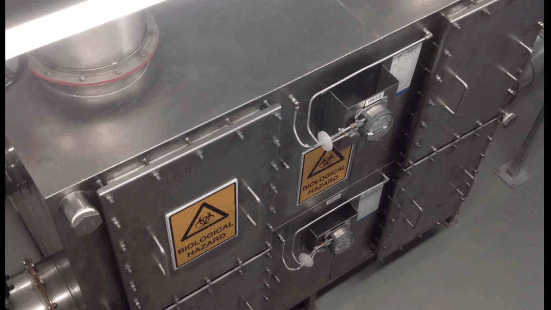 A stainless steel box with warning signs on it
