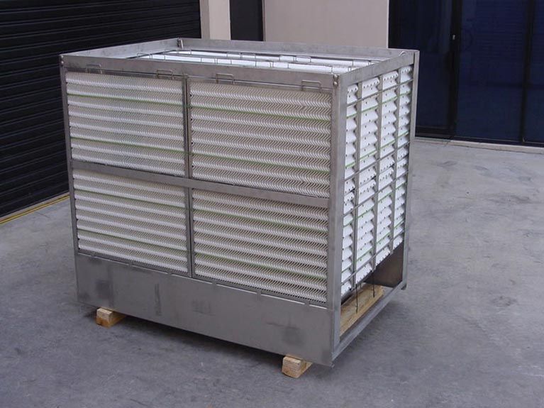 A large stainless steel box with white sheets on it